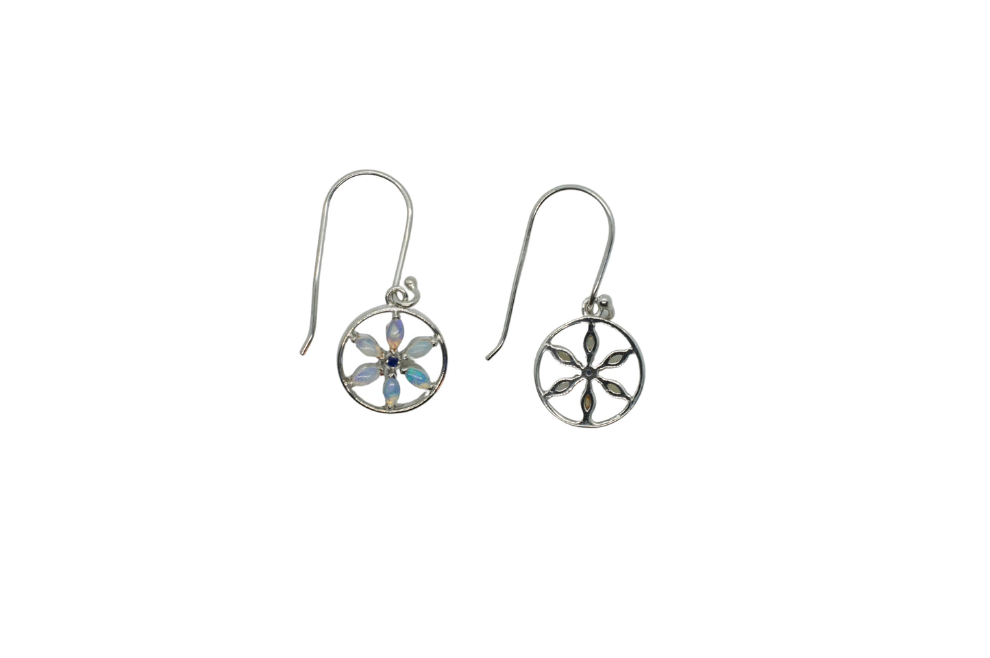 Pair of silver earrings with floral designs on a light gray background