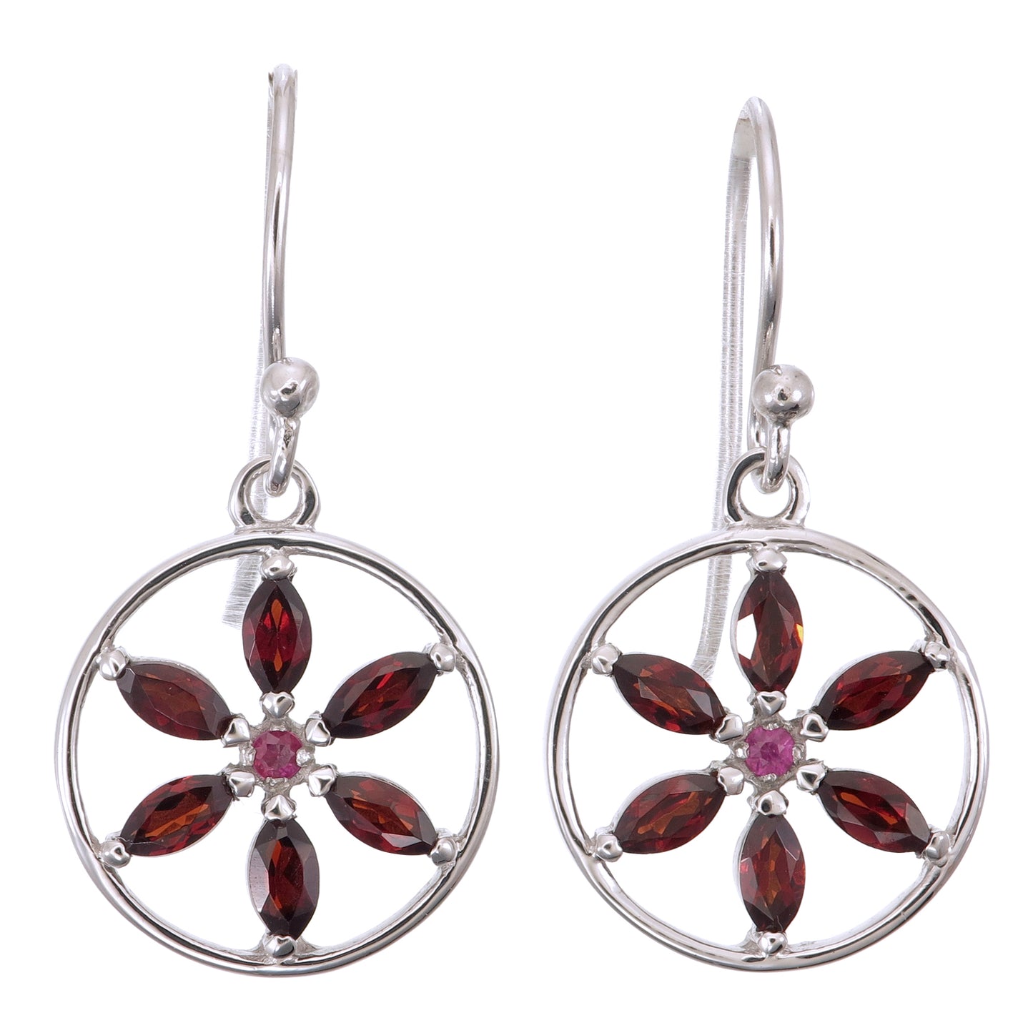Silver earrings with red gemstones on a white background