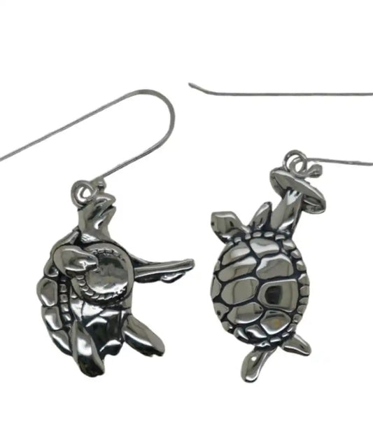 A pair of sterling silver earrings designed in the shape of terrapin turtles, one turtle playing a banjo and the other playing a tambourine, suspended from hooks.