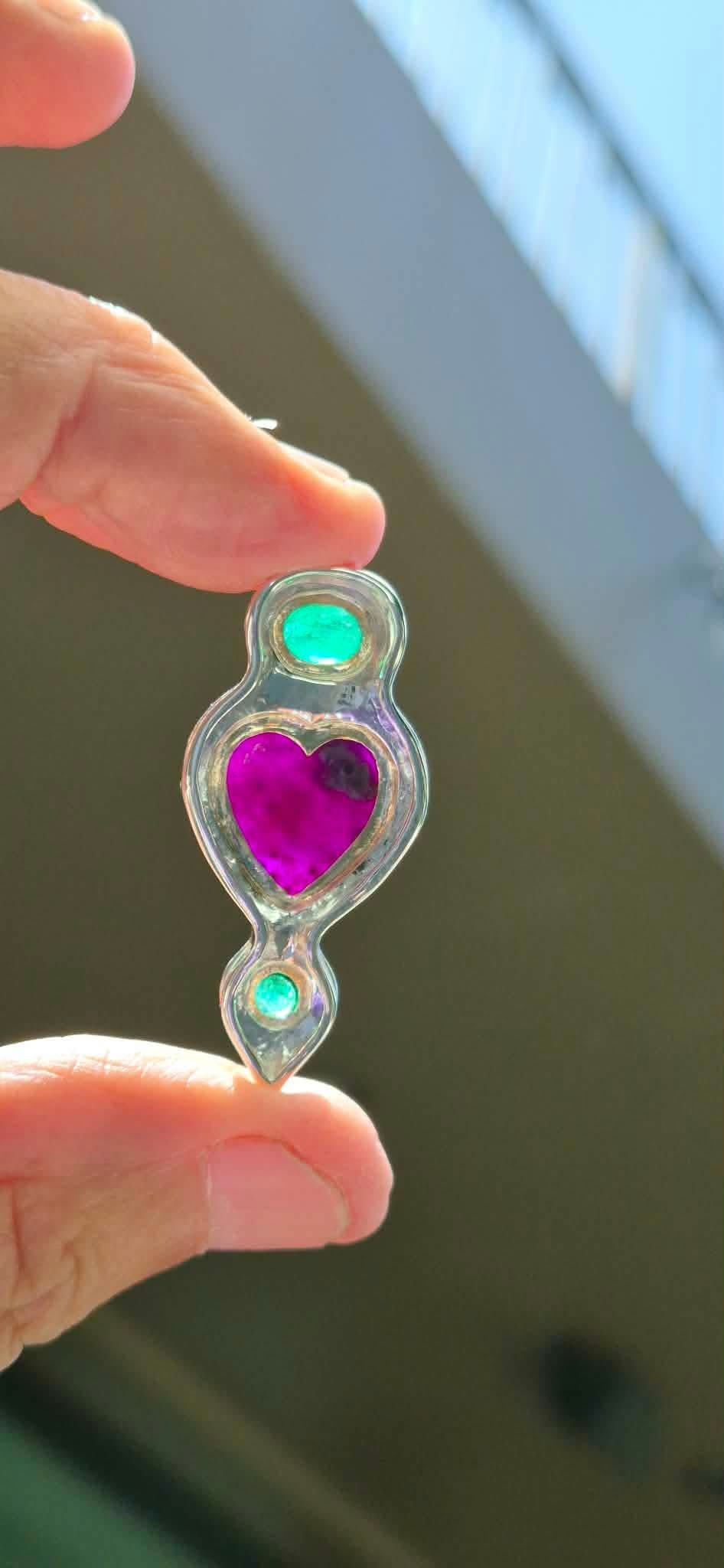 Muzo Colombian emerald cabochon in 18k gold bezel with sterling silver beaded border