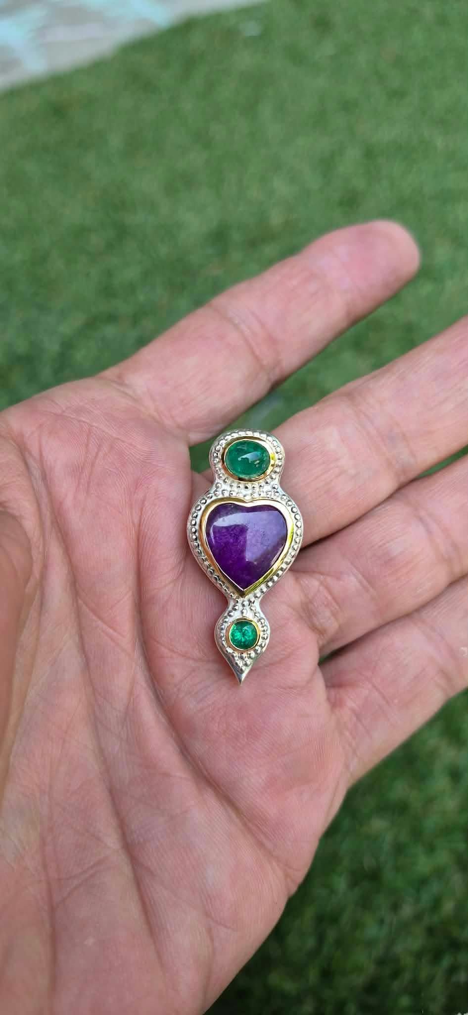 Emerald sugilite pendant, 1.5 inches long by 1 1/8 inches wide in palm of hand