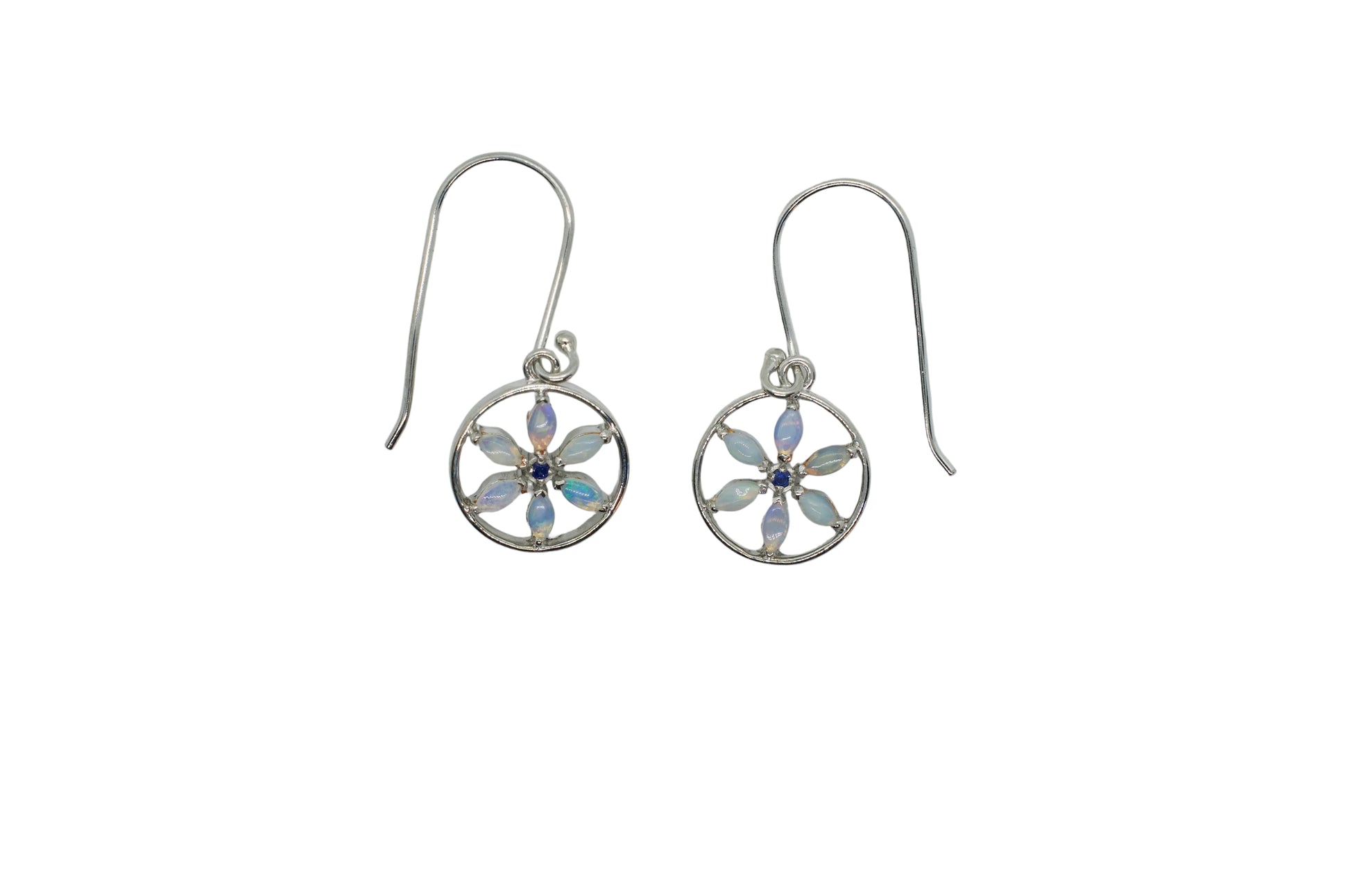 Silver earrings with floral designs on a white background