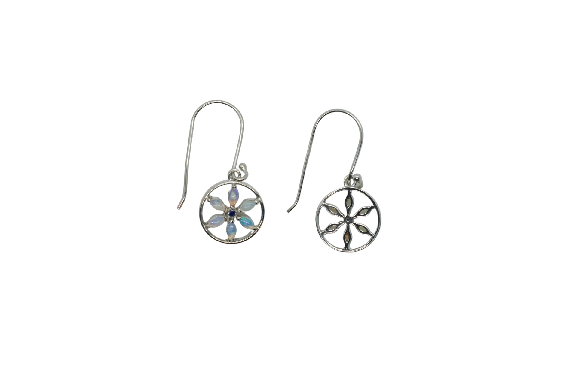 Pair of silver earrings with floral designs on a light gray background