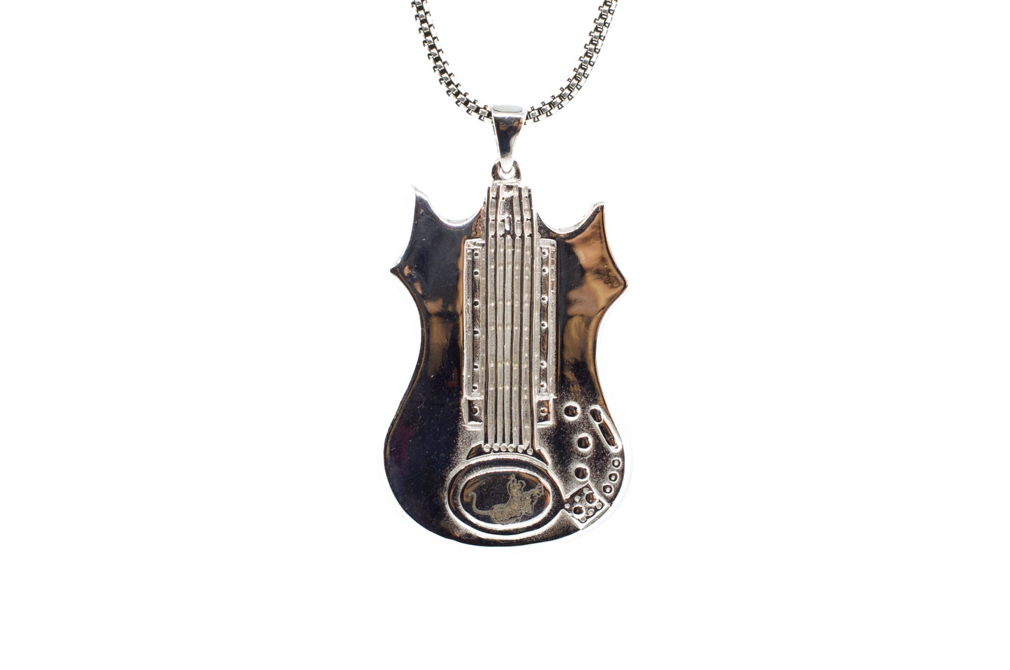 Guitar-shaped pendant on a chain against a white background