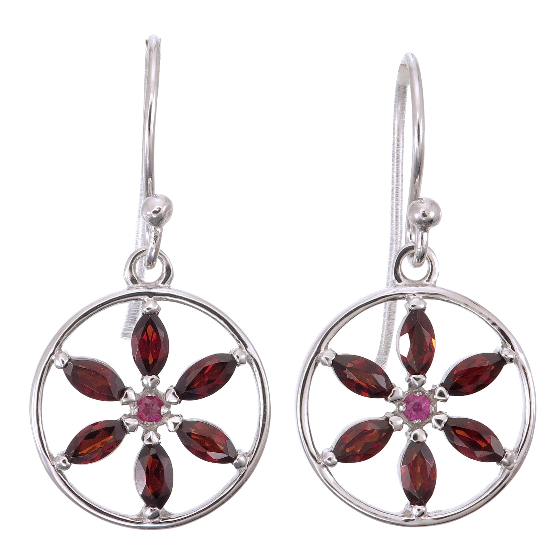 Silver earrings with red gemstones on a white background