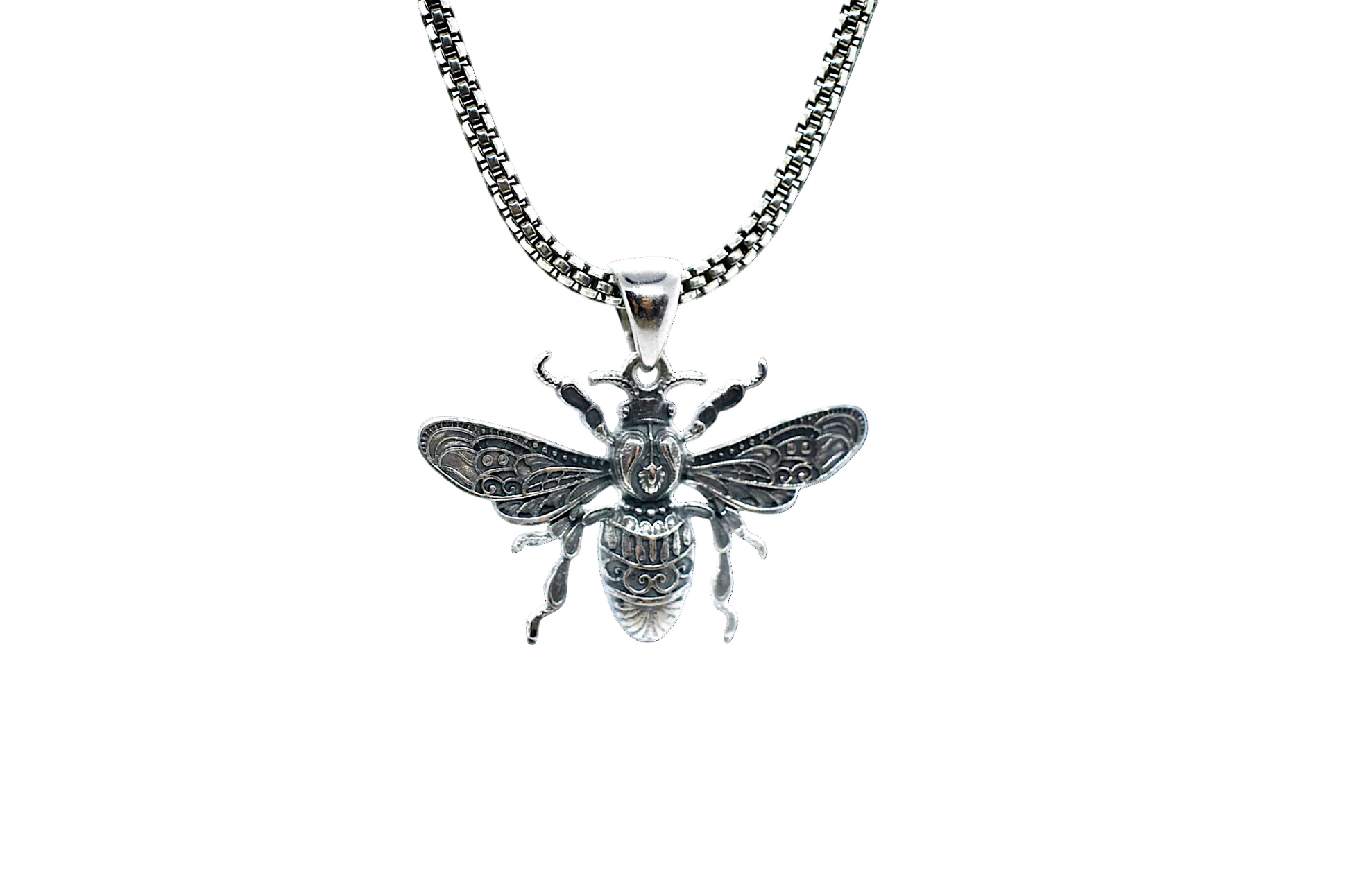 Silver bee pendant on a chain against a white background