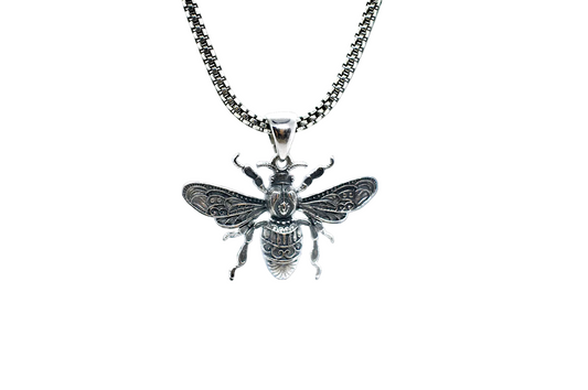 Silver bee pendant on a chain against a white background