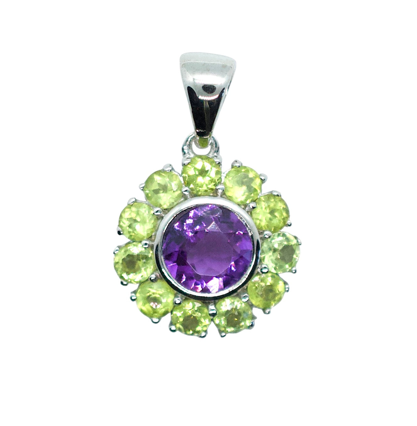 Jewelry pendant with purple gemstone and green stones on a white background