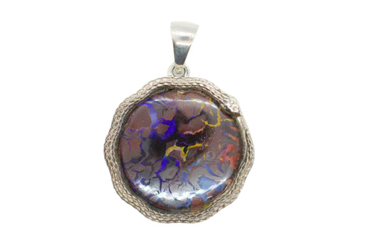 A sterling silver necklace with a round boulder opal pendant surrounded by a snake motif.