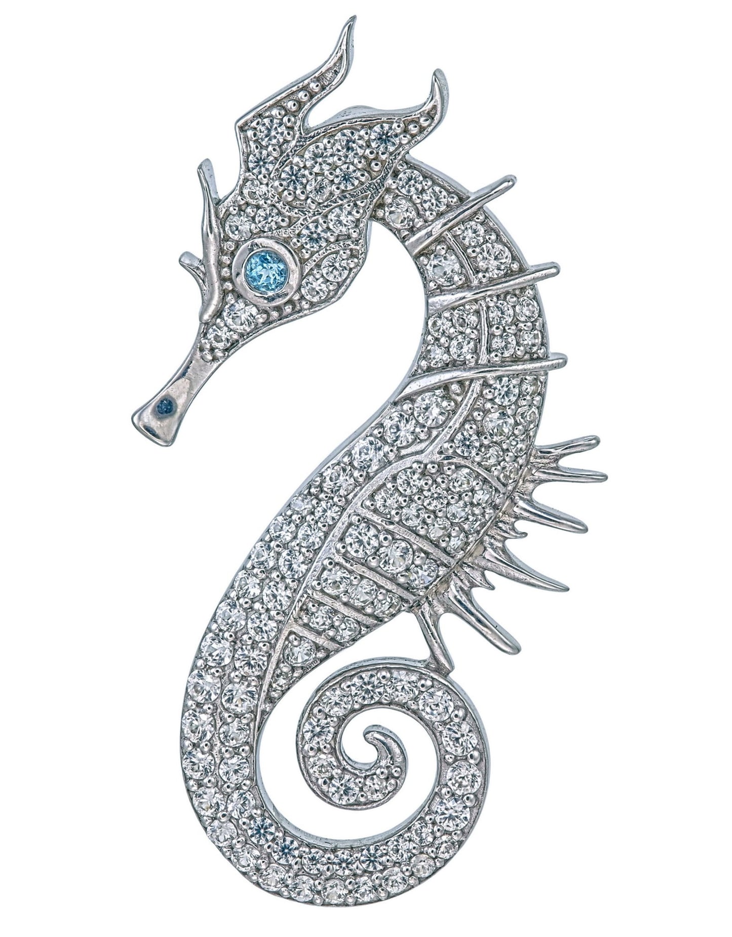 Jewelry item resembling a seahorse with gemstones on a white background