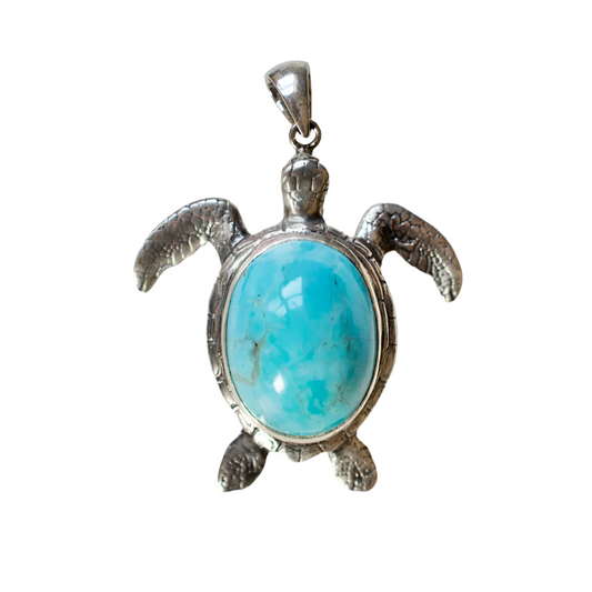 A sterling silver turtle-shaped pendant necklace with a turquoise gemstone in the center.